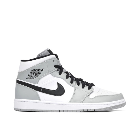 Jordan 1 Mid Light Smoke Grey by Jordan's in Shoes. Available at KershKicks for £235.00. A must-have for fans of Jordan's looking to elevate their style with this Shoes.