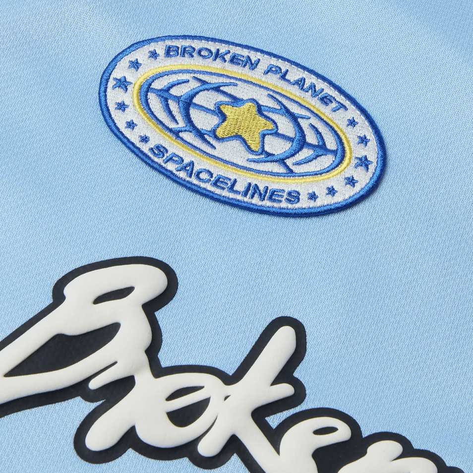 Broken Planet Market Football Jersey Light Blue by Broken Planet Market in Uncategorized. Available at KershKicks for £115.00. A must-have for fans of Broken Planet Market looking to elevate their style with this T-Shirt.