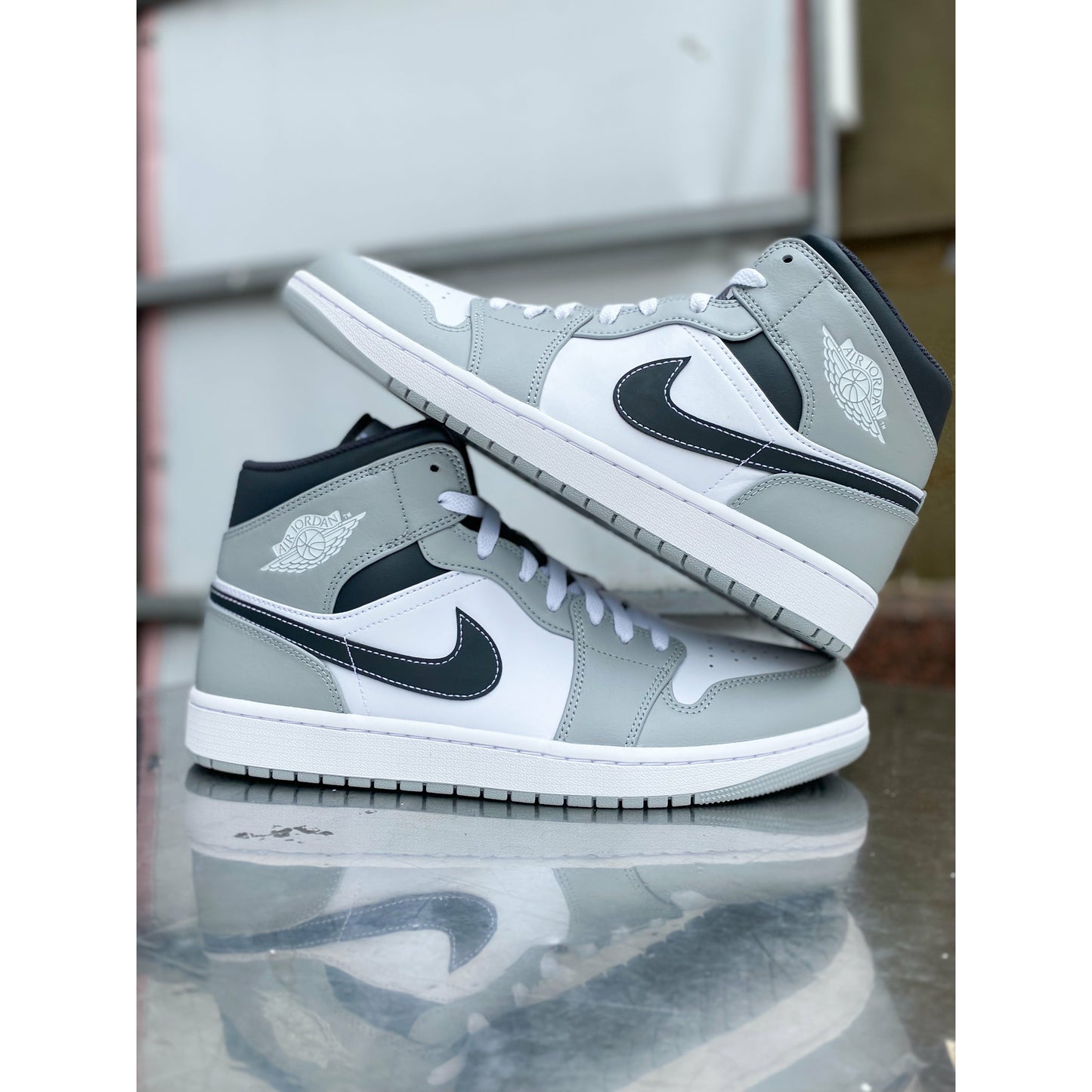 Jordan 1 Mid Light Smoke Grey Anthracite by Jordan's in Shoes. Available at KershKicks for £185.00. A must-have for fans of Jordan's looking to elevate their style with this Shoes.