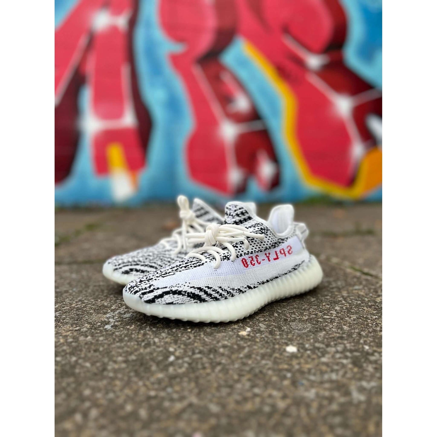 Adidas Yeezy Boost 350 V2 Zebra by Yeezy in Shoes. Available at KershKicks for £325.00. A must-have for fans of Yeezy looking to elevate their style with this Shoes.