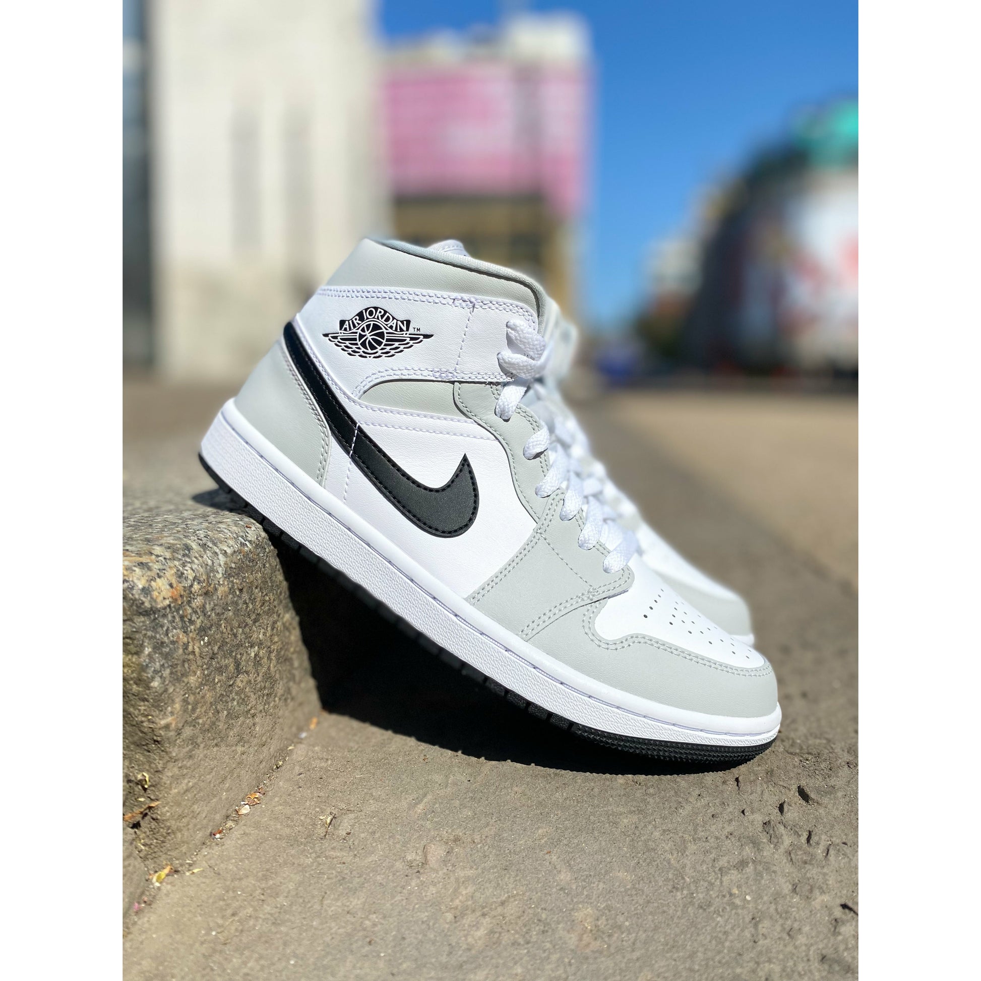 Jordan 1 Mid Light Smoke Grey (W) by Jordan's in Shoes. Available at KershKicks for £175.00. A must-have for fans of Jordan's looking to elevate their style with this Shoes.