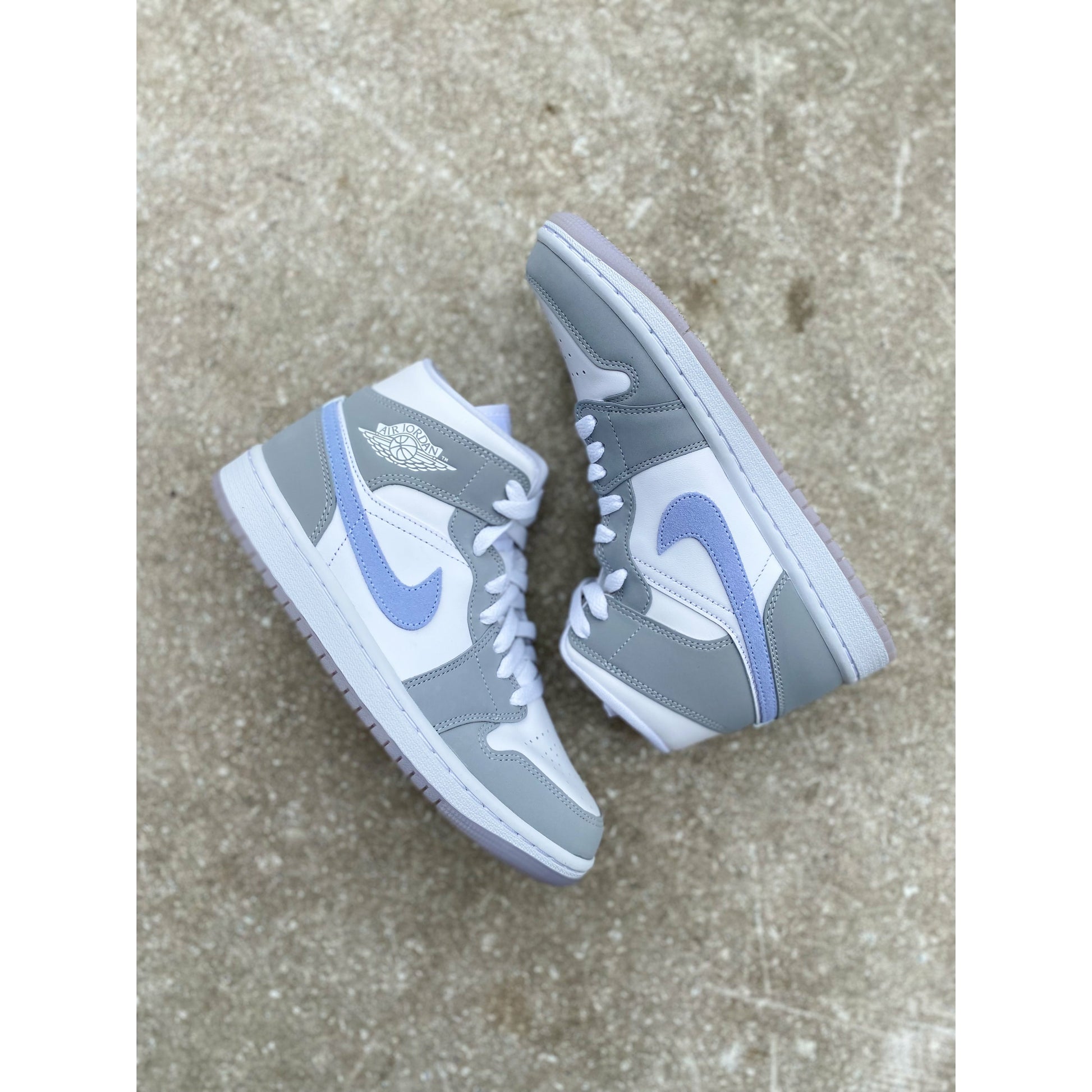 Jordan 1 Mid Wolf Grey Aluminum (W) by Jordan's in Shoes. Available at KershKicks for £165.00. A must-have for fans of Jordan's looking to elevate their style with this Shoes.