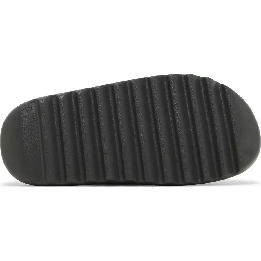 adidas Yeezy Slide Dark Onyx by Yeezy in Shoes. Available at KershKicks for £110.00. A must-have for fans of Yeezy looking to elevate their style with this Shoes.