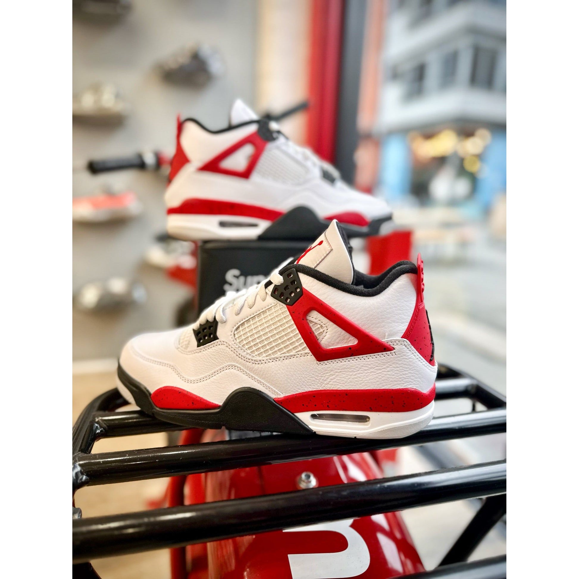 Jordan 4 Retro Red Cement by Jordan's in Shoes. Available at KershKicks for £270.00. A must-have for fans of Jordan's looking to elevate their style with this Shoes.