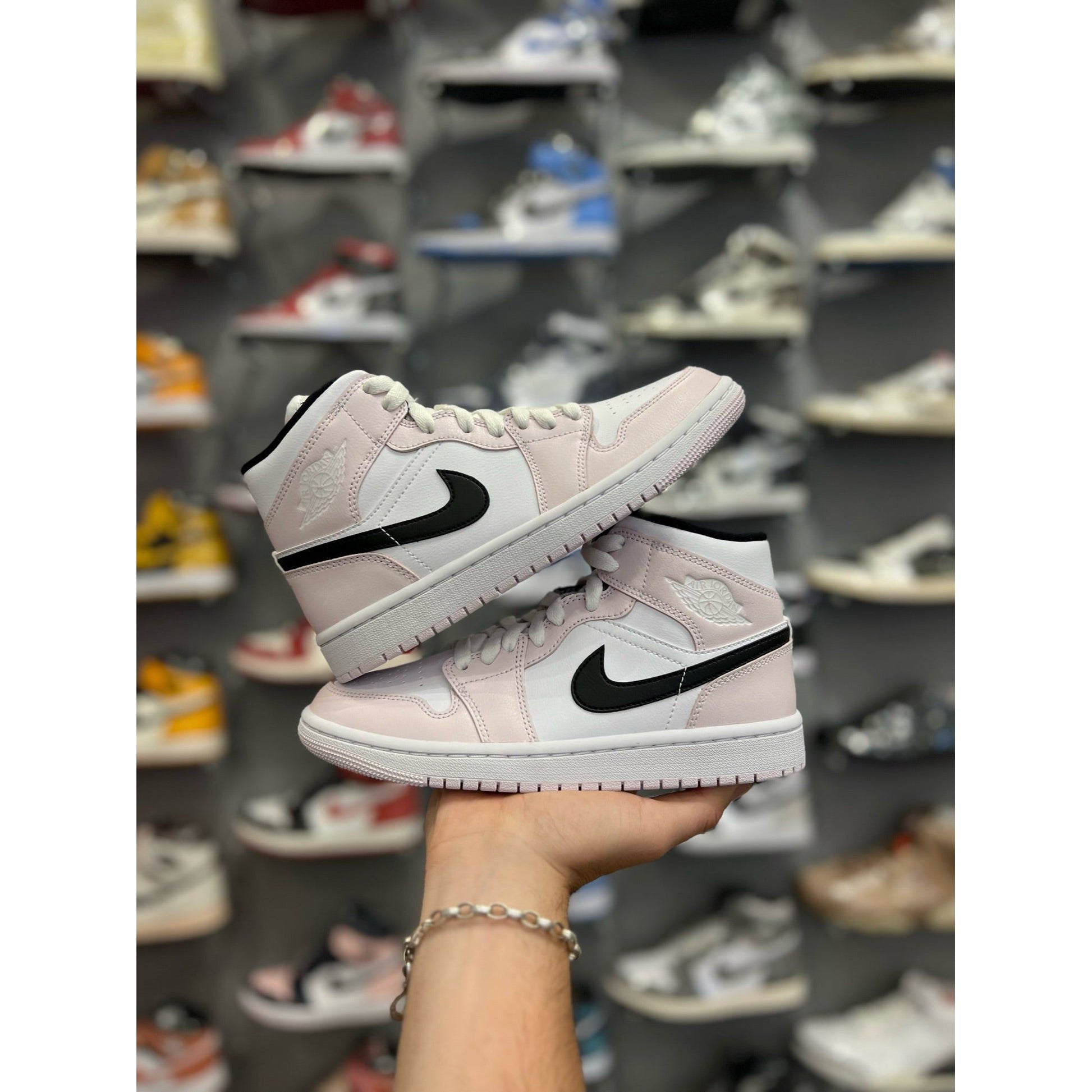 Jordan 1 Mid Barely Rose (W) by Jordan's in Shoes. Available at KershKicks for £175.00. A must-have for fans of Jordan's looking to elevate their style with this Shoes.