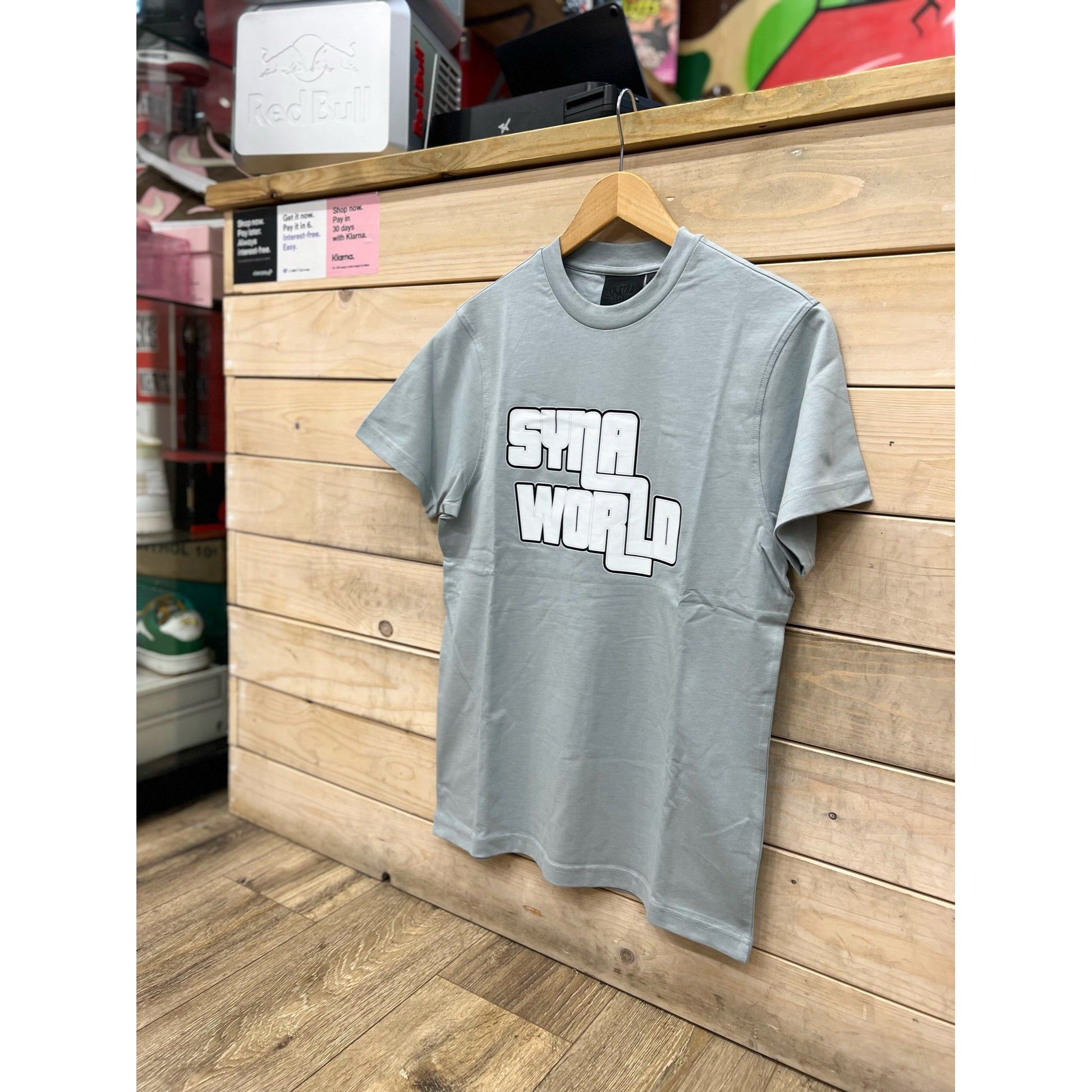 Syna World GTA Logo T-shirt Grey by SYNA in Clothing. Available at KershKicks for £85.00. A must-have for fans of SYNA looking to elevate their style with this T-Shirt.