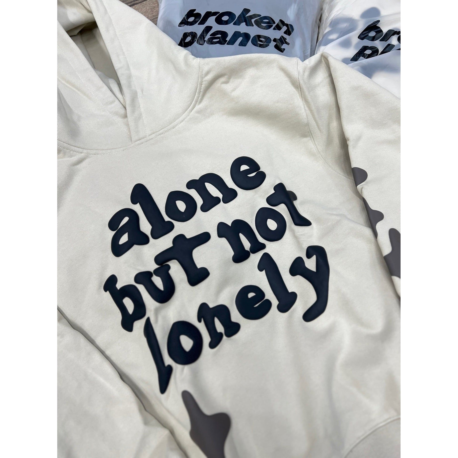 Broken Planet Market Alone But Not Lonely Hoodie White by Broken Planet Market in Clothing. Available at KershKicks for £175.50. A must-have for fans of Broken Planet Market looking to elevate their style with this Hoodie.