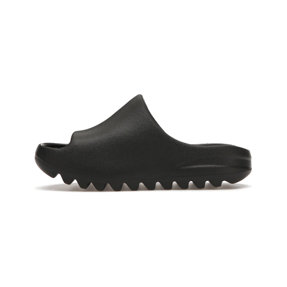 Yeezy Slide Onyx (Kids) by Adidas in Shoes. Available at KershKicks for £70.00. A must-have for fans of Adidas looking to elevate their style with this Kids Trainers.