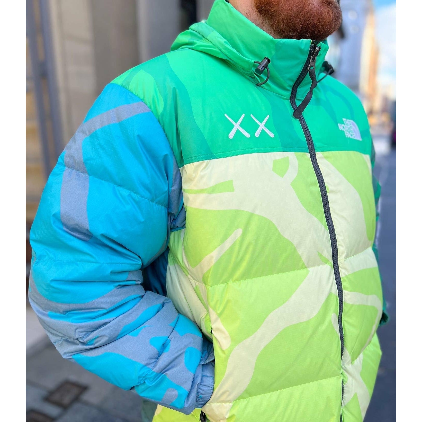 KAWS x The North Face Retro 1996 Nuptse Jacket Safety Green by Kaws in Clothing. Available at KershKicks for £300.00. A must-have for fans of Kaws looking to elevate their style with this Jacket.