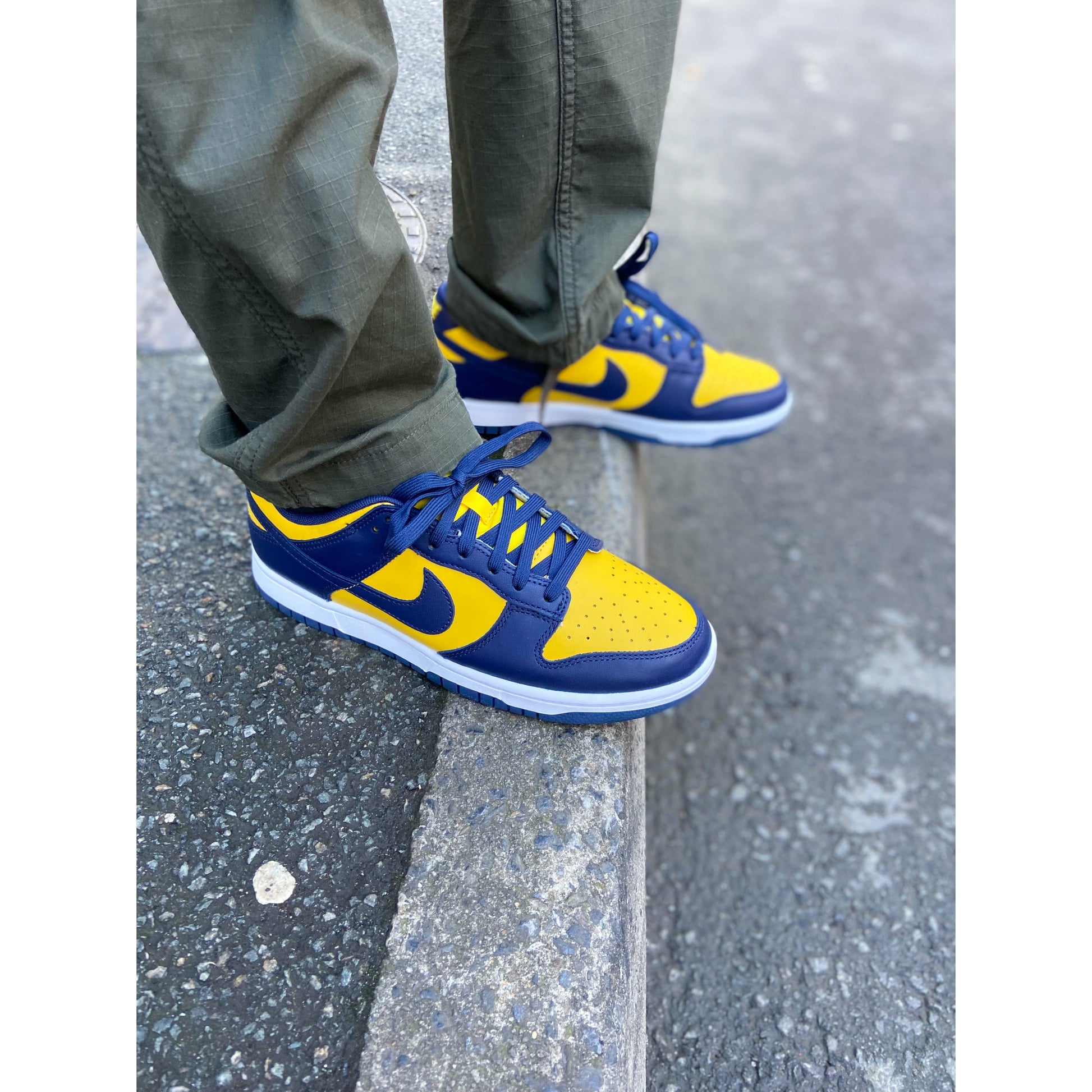 Nike Dunk Low Michigan (2021/2023) (GS) by Nike in Shoes. Available at KershKicks for £135.00. A must-have for fans of Nike looking to elevate their style with this Shoes.
