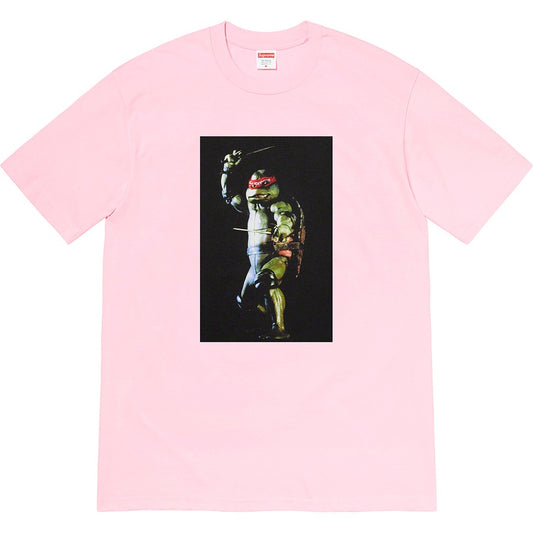 Supreme Raphael Tee Light Pink by Supreme in . Available at KershKicks for £85.00. A must-have for fans of Supreme looking to elevate their style with this T-Shirt.