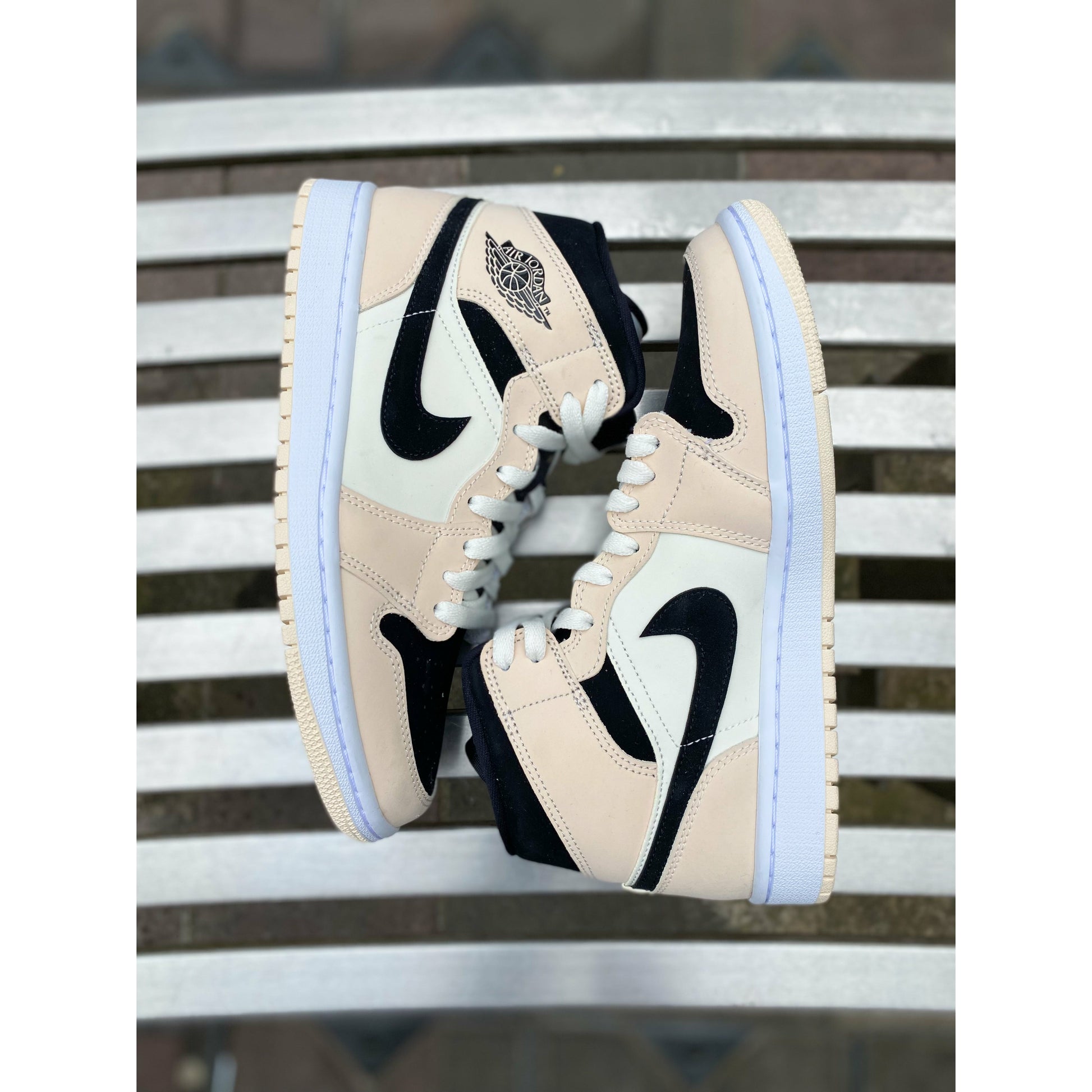 Jordan 1 Mid Barely Orange (W) by Jordan's in Shoes. Available at KershKicks for £250.00. A must-have for fans of Jordan's looking to elevate their style with this Shoes.
