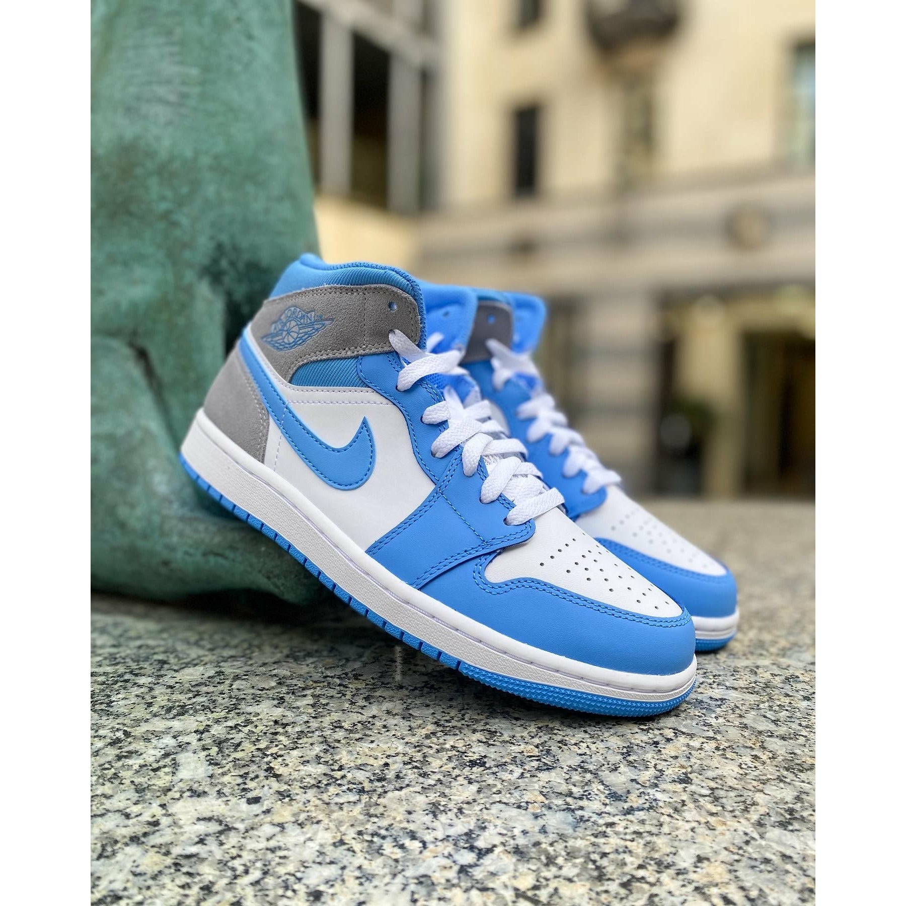 Jordan 1 Mid University Blue Grey by Jordan's in Shoes. Available at KershKicks for £195.00. A must-have for fans of Jordan's looking to elevate their style with this Shoes.