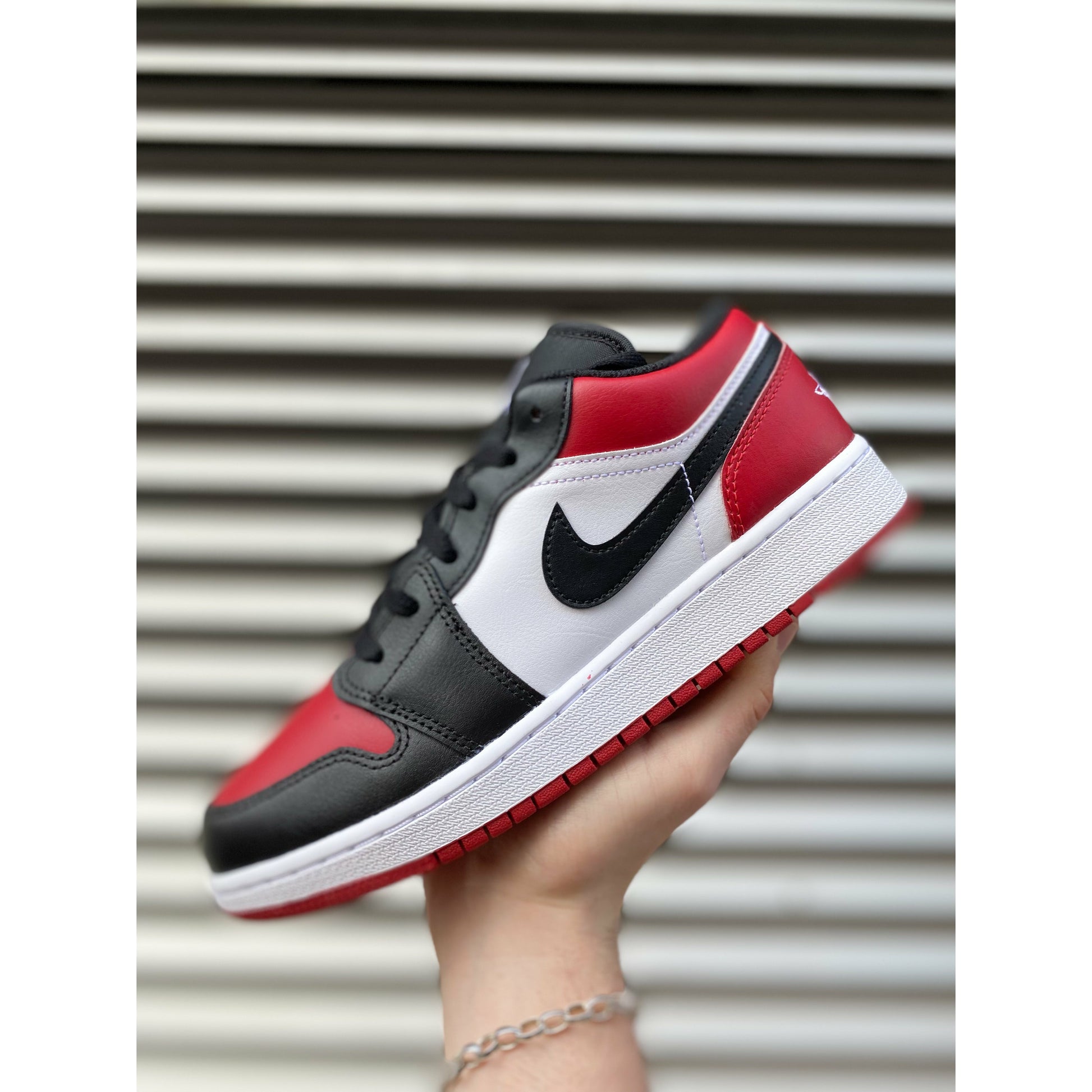 Jordan 1 Low Bred Toe (GS) by Jordan's in Shoes. Available at KershKicks for £95.00. A must-have for fans of Jordan's looking to elevate their style with this Shoes.
