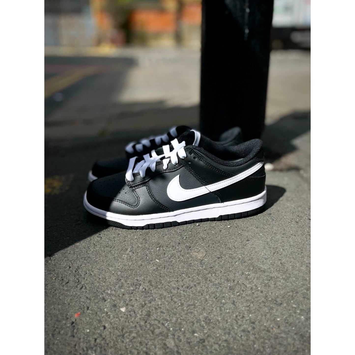 Nike Dunk Low Black White (2022) (GS) by Nike in Shoes. Available at KershKicks for £85.00. A must-have for fans of Nike looking to elevate their style with this Shoes.