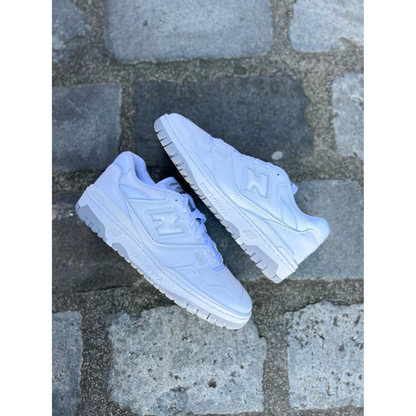 New Balance 550 White Grey by New Balance in Shoes. Available at KershKicks for £135.00. A must-have for fans of New Balance looking to elevate their style with this Shoes.