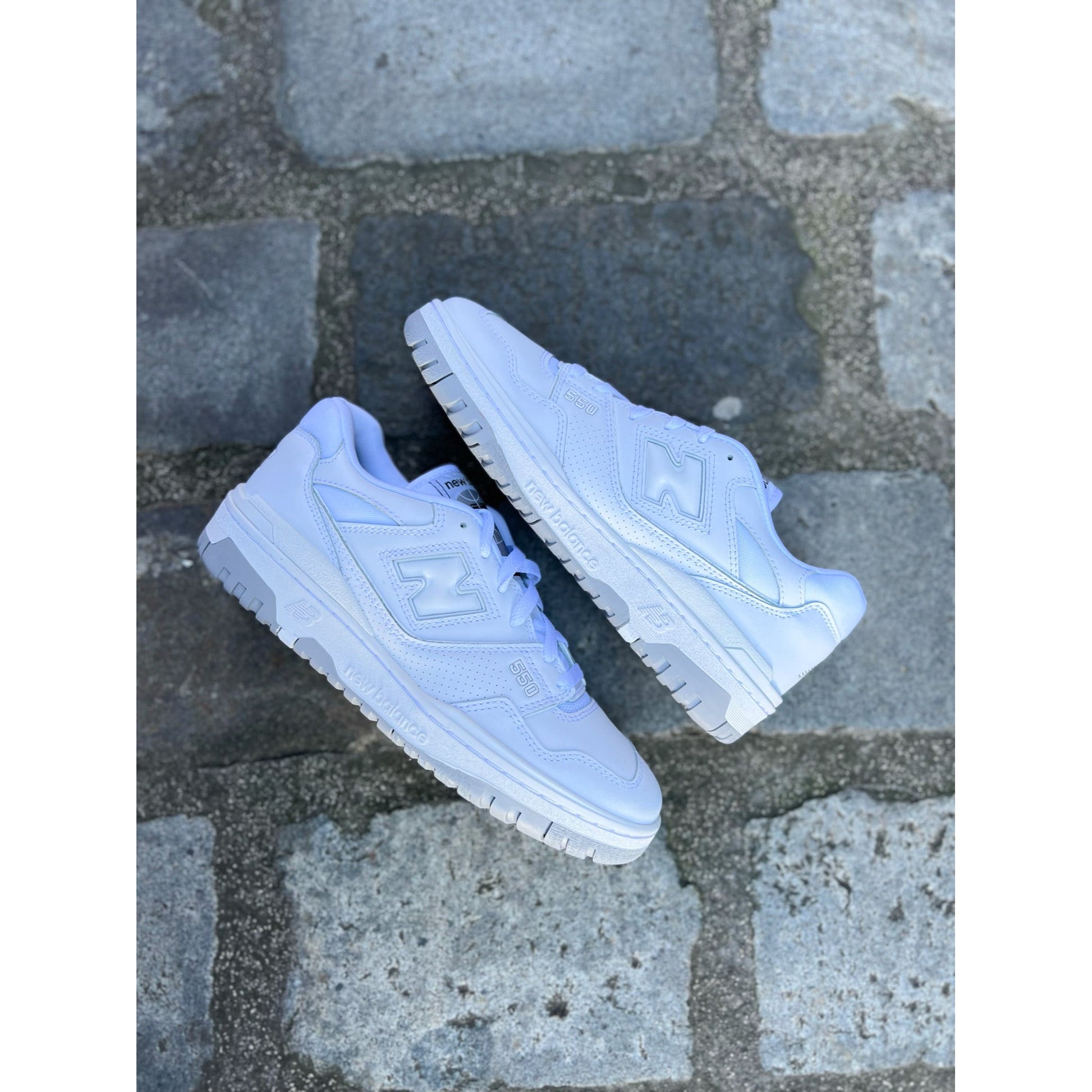 New Balance 550 White Grey by New Balance in Shoes. Available at KershKicks for £135.00. A must-have for fans of New Balance looking to elevate their style with this Shoes.